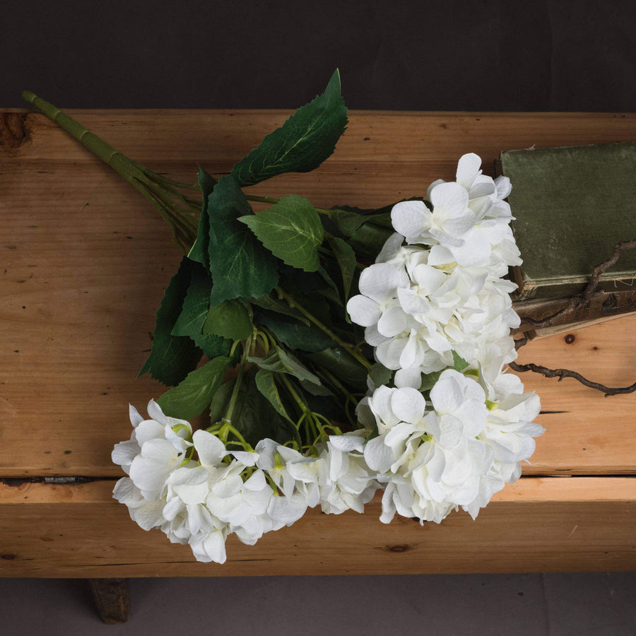 Creamy off-white artificial hydrangea bouquet with ultra-realistic petals, perfect for timeless home decor. by Sostter at brixbailey.com