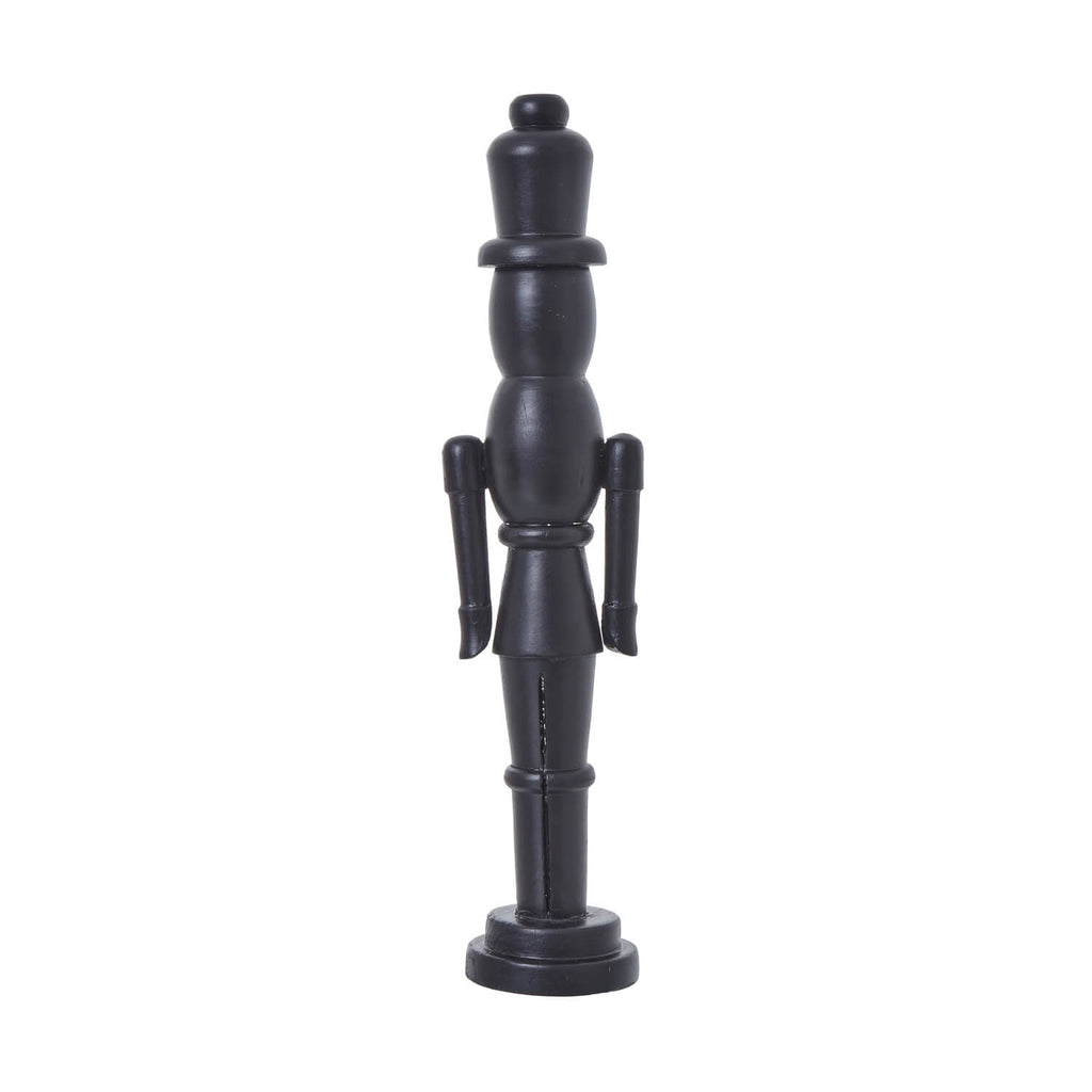 Black wooden Nordic nutcracker with minimalist design, 50cm tall, for modern Christmas decor. by Sostter at brixbailey.com