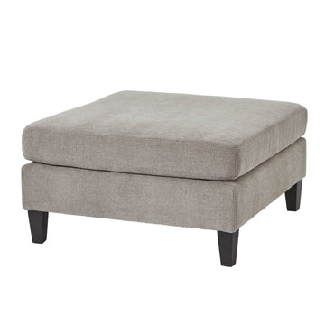 Taupe velvet ottoman footstool with wooden legs, plush cushioning, and modern farmhouse design for living room decor by Sostter at brixbailey.com