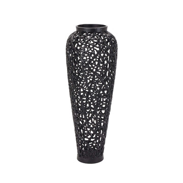 Matte black lattice vase with geometric cutouts, casting dynamic shadows, made of architectural-grade aluminum. by Sostter at brixbailey.com
