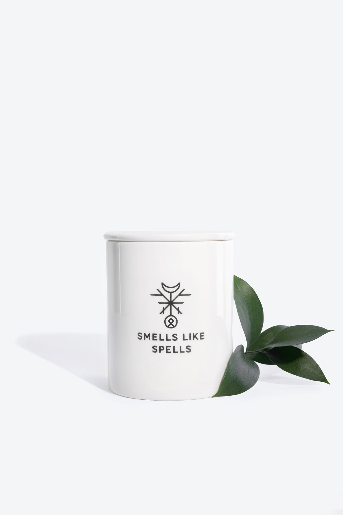 a soft-lit view of the fool tarot candle in its handmade porcelain jar, evoking calm and new beginnings