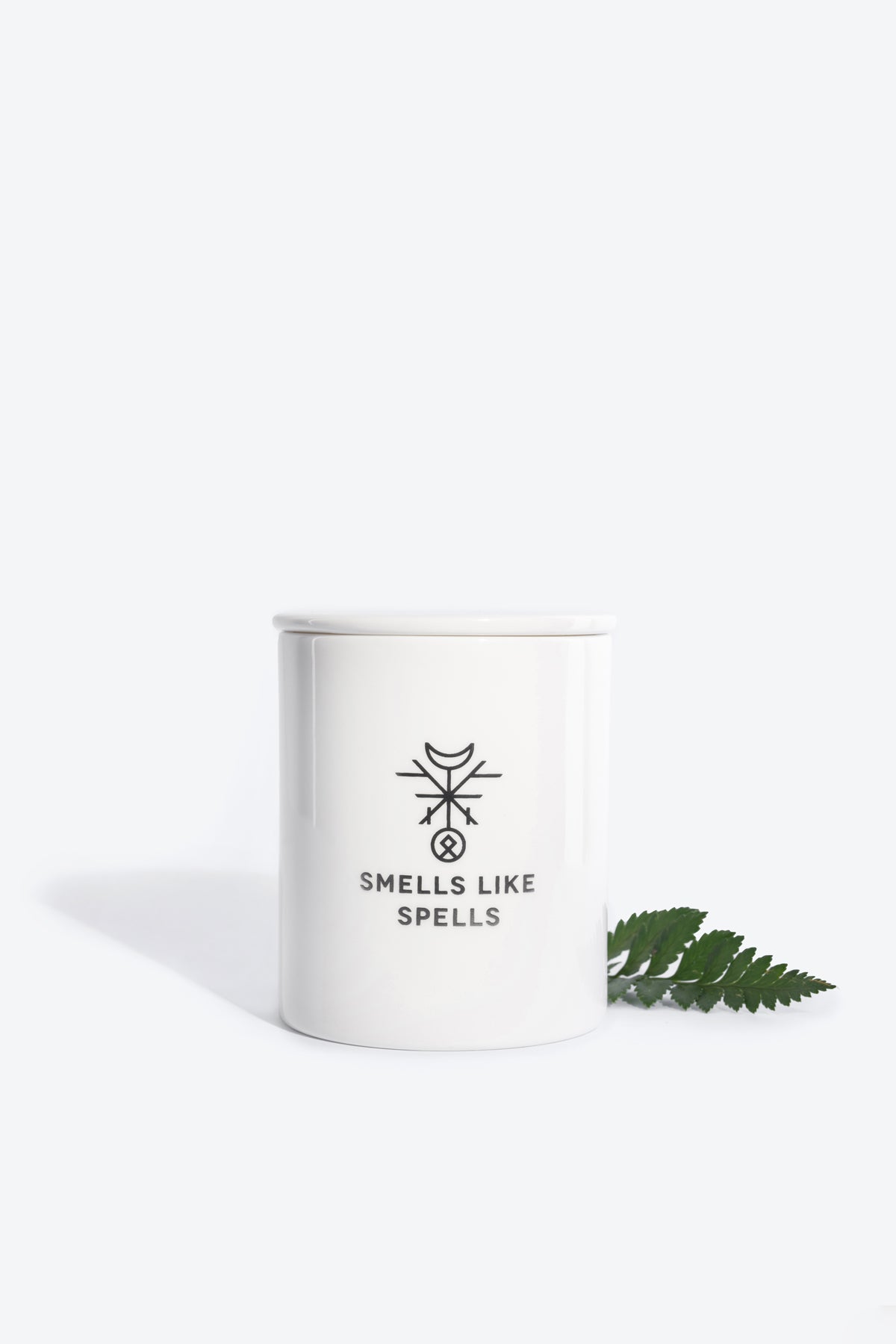 bold front view of the lovers tarot scented candle in handmade porcelain, glowing with mystical energy