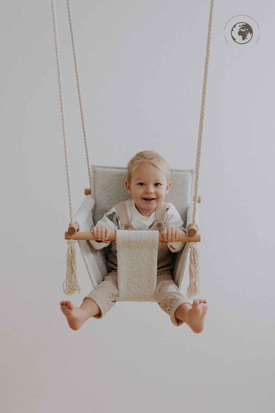 Nordic Bouclé Baby Swing – Sustainable & Child-Safe Comfort by Nofi KIDS at www.brixbailey.com