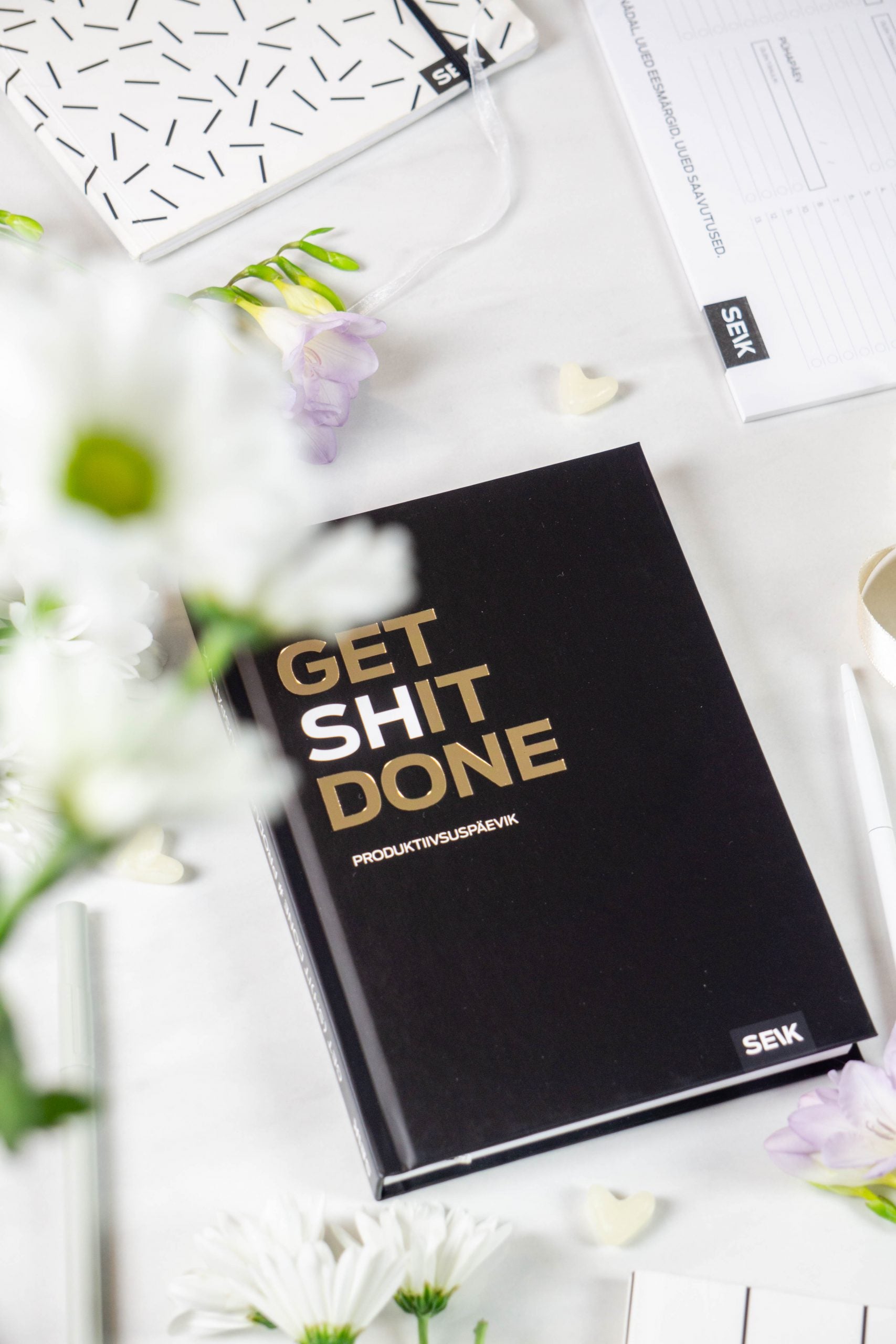 softly lit productivity planner open on a cozy desk with morning coffee