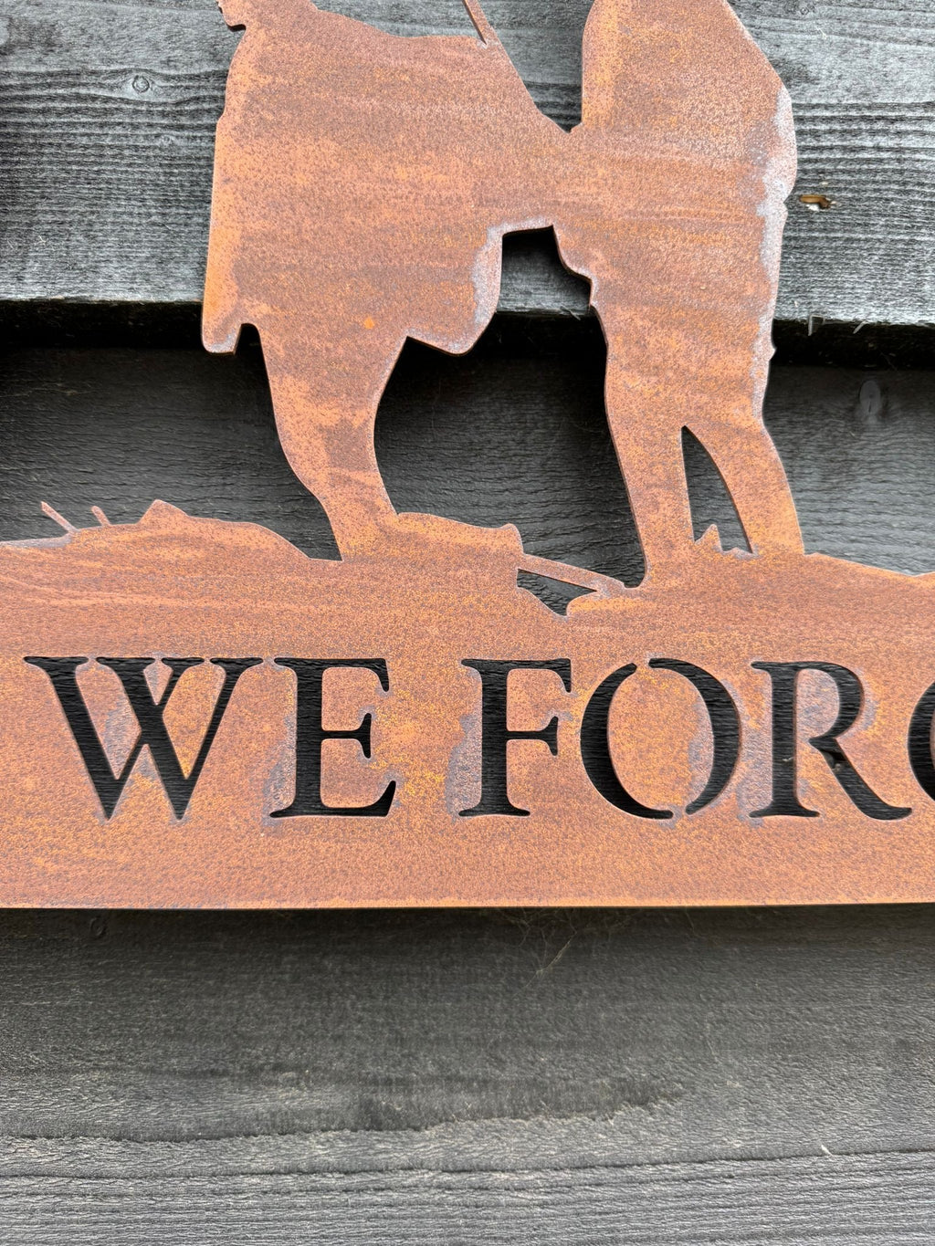 A Rusty Metal Lest We Forget Soldier Scene Garden Decoration