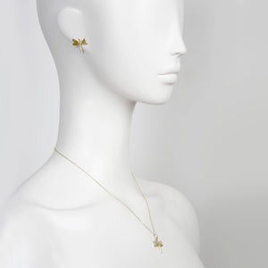 softly lit gold dragonfly pendant on a delicate chain, a comforting gift for her
