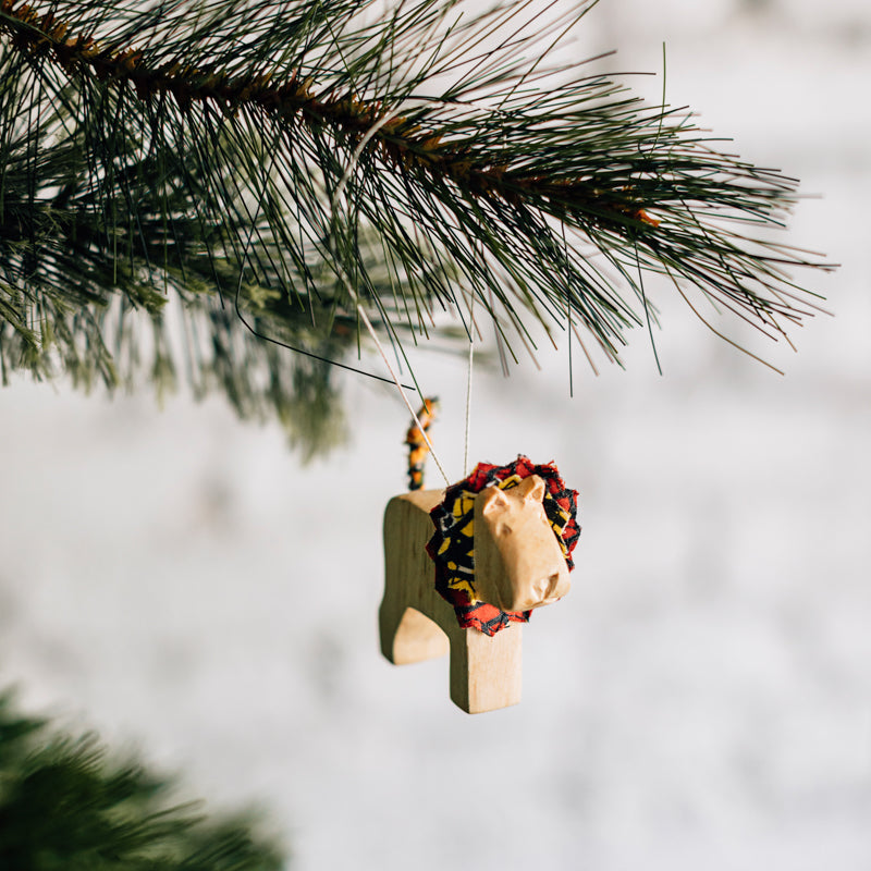 Hand Carved Animal Ornament in Natural Wood
