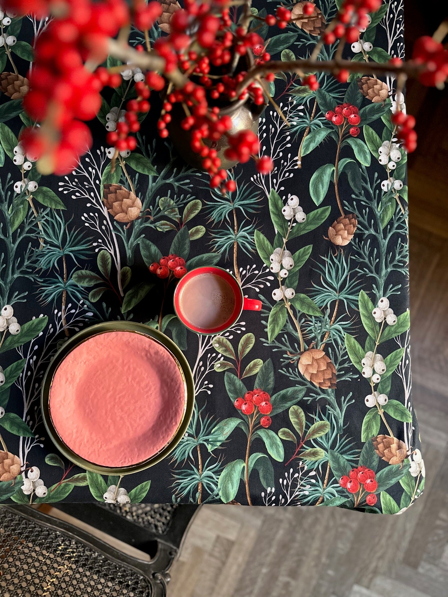 bold christmas forest tablecloth on a grand dining table set for a festive feast