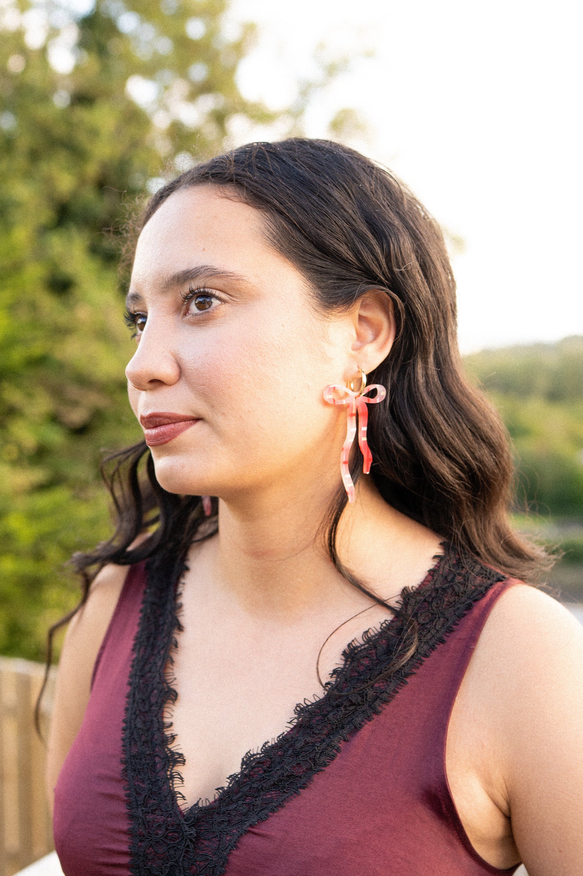 Pearlescent Beige Dangly Bow Hoop Earrings