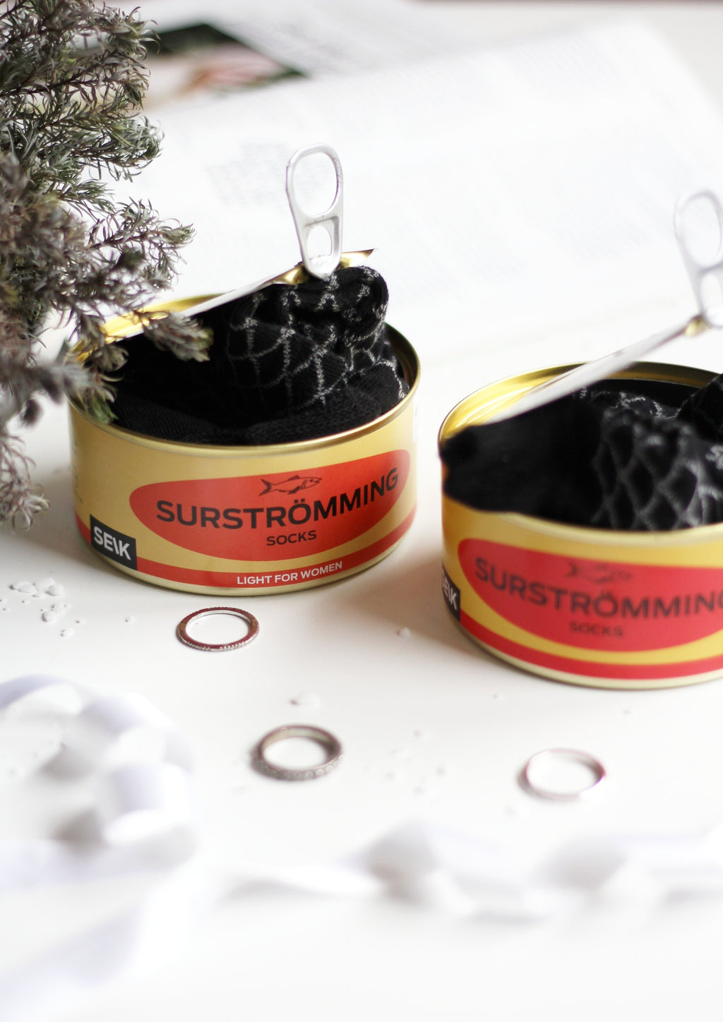 confident close-up of a stylish surströmming sock gift set in a tin can for men sizes 40-46