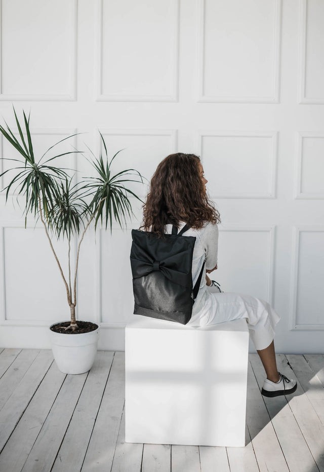 Stylish Black Bow Backpack - Waterproof & Spacious by Muni at brixbailey.com