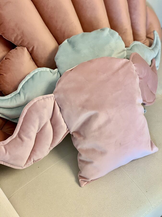 Handmade decorative cushion “Wings”. The pillow of extraordinary design will provide coziness and exclusivity in each child’s room. The pillow is made of high quality velvet material. This material is very gentle, so children will enjoy touching it. Color: Light pink Pillow dimensions: Height 34 cm (wings 72 cm wide with a pillow), width 27 cm Composition: 100% polyester Padding: siliconized sintepon Made with love and care in Lithuania by Kai aš mažas buvau at www.brixbailey.com