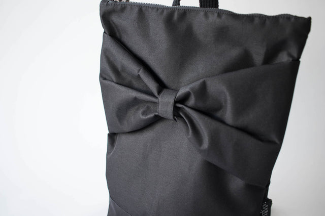 Black Bow Backpack – Stylish, Waterproof & Spacious for Travel by Muni at brixbailey.com