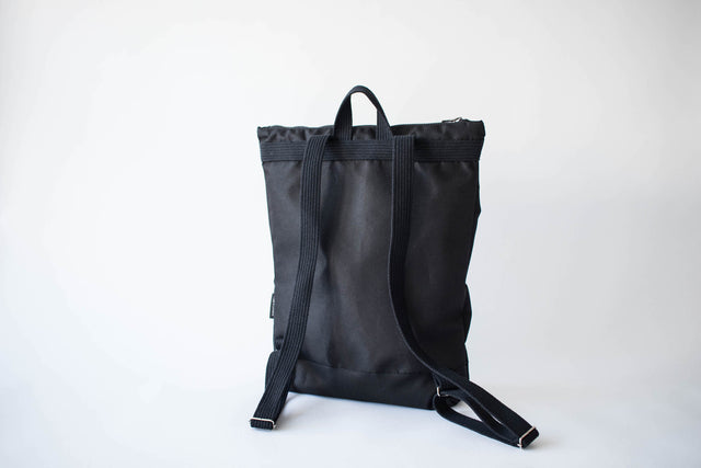 Chic Black Bow Backpack – Stylish & Waterproof Storage by Muni at brixbailey.com