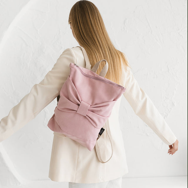 Pink Bow Denim Backpack – Fun & Fashionable Accessory by Muni at brixbailey.com