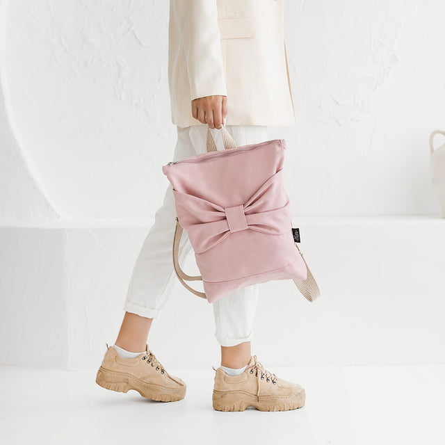 Chic Pink Denim Backpack with Bow – Fun & Functional by Muni at www.brixbailey.com