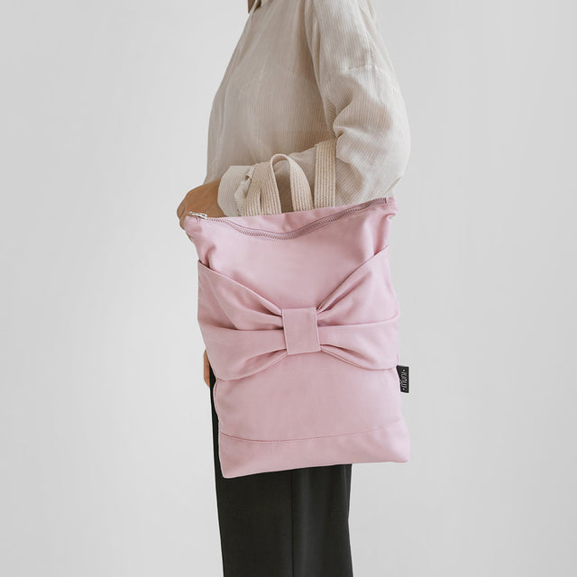 Pink Bow Backpack – Playful Elegance in Pink Denim by Muni at brixbailey.com