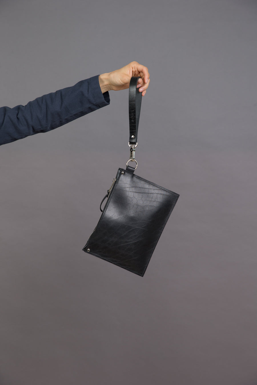 Sleek Black Leather Clutch – Perfect for Evening Events by PYKOK at brixbailey.com