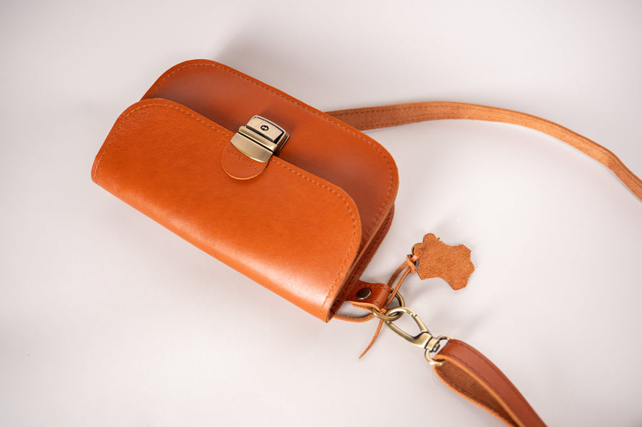 Classic Cut Leather Saddle Bag – Timeless Elegance by Zelma Kraft by Zelma Kraft at brixbailey.com