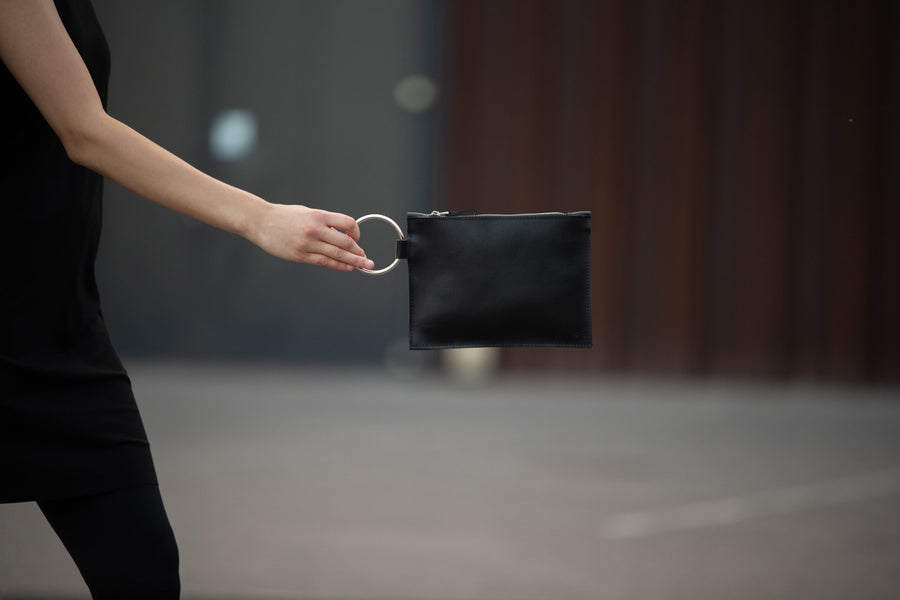 Sleek Black Leather Clutch with Metal Ring Handle – PYKOK by PYKOK at brixbailey.com