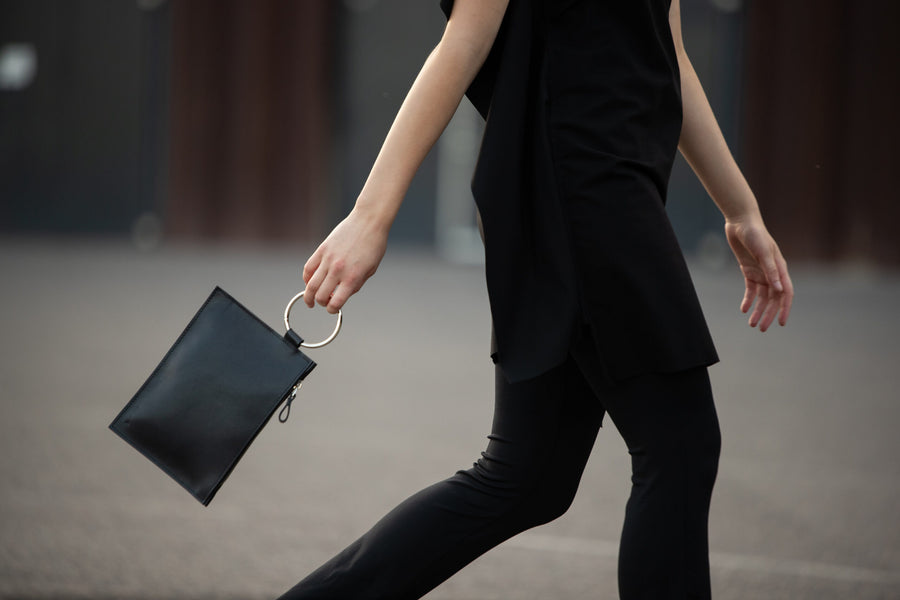 Sleek Black Leather Clutch with Metal Ring – Elegant & Modern by PYKOK at brixbailey.com