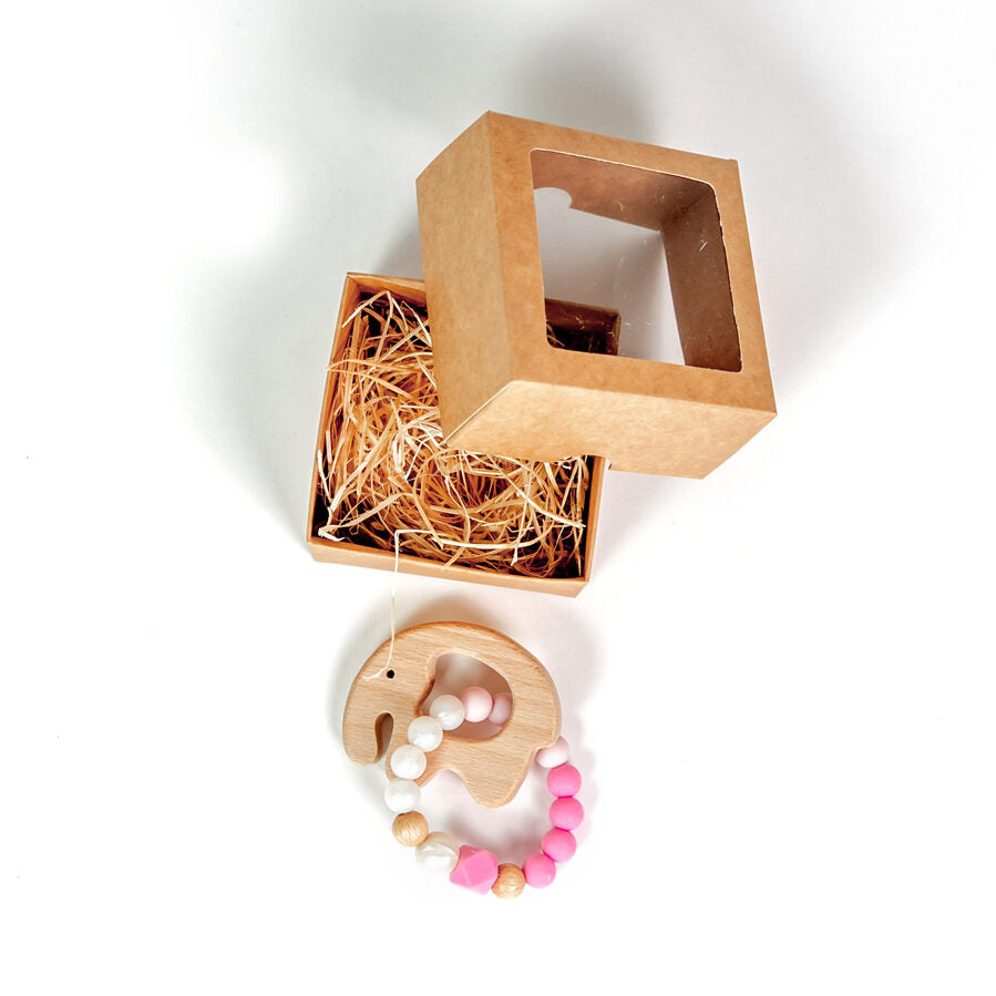 Soothe & Delight: Light Pink Baby Teether with Wooden Elephant - Perfect Gift for Infants by Kai aš mažas buvau at www.brixbailey.com