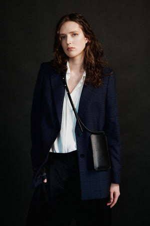 bold black leather crossbody phone bag with gold hardware and card slots