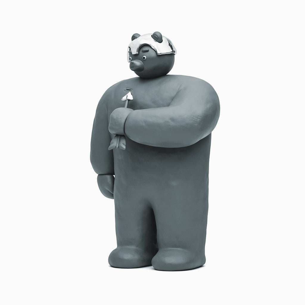 A Bear With An Arrow Sculpture