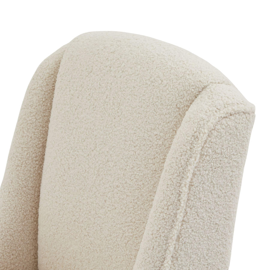 Cream bouclÃ© dining chair with rubberwood frame, modern silhouette, and quiet luxury aesthetic by Sostter at brixbailey.com