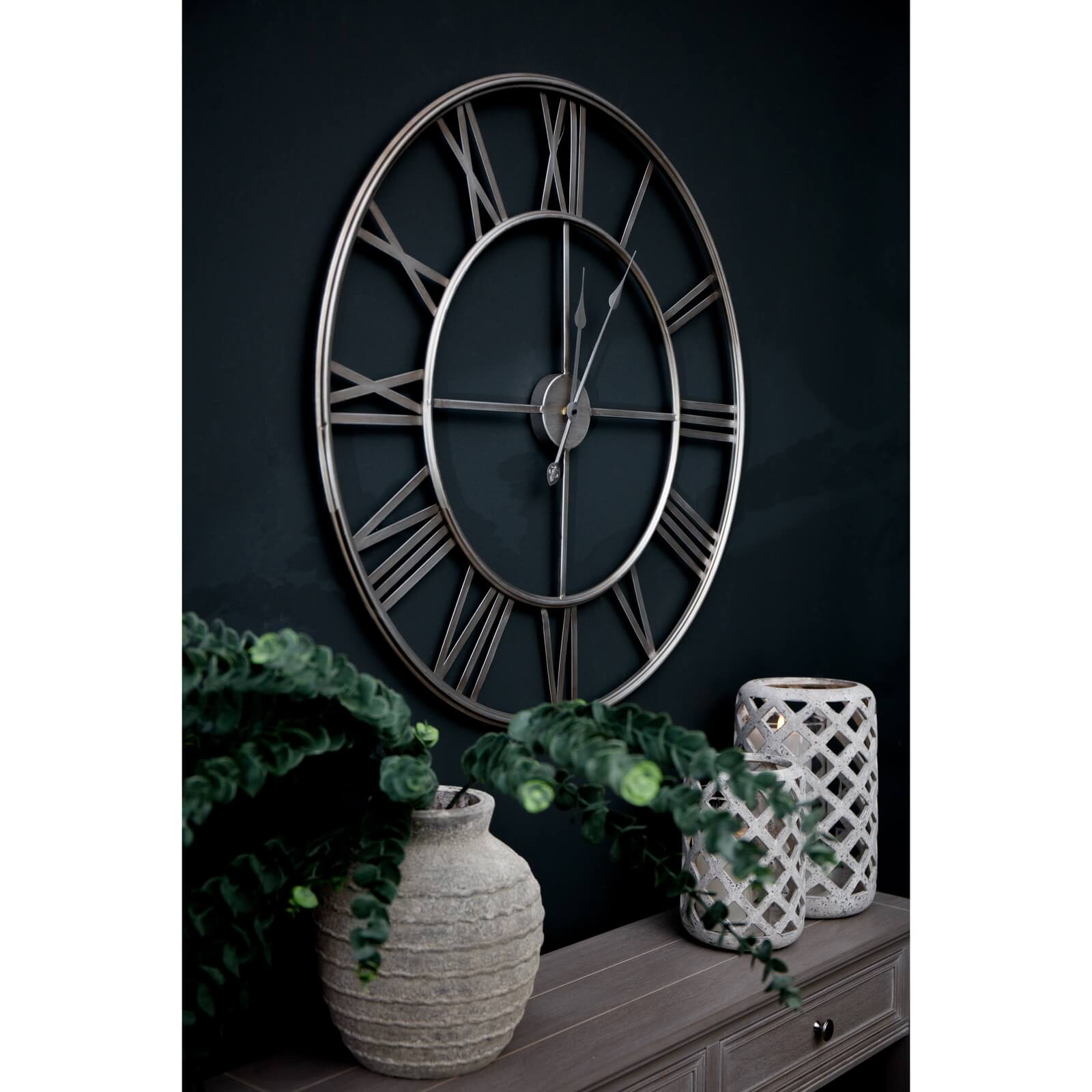 Modern silver circular wall shelf with industrial-chic metal design, perfect for displaying plants and decor by Sostter at brixbailey.com