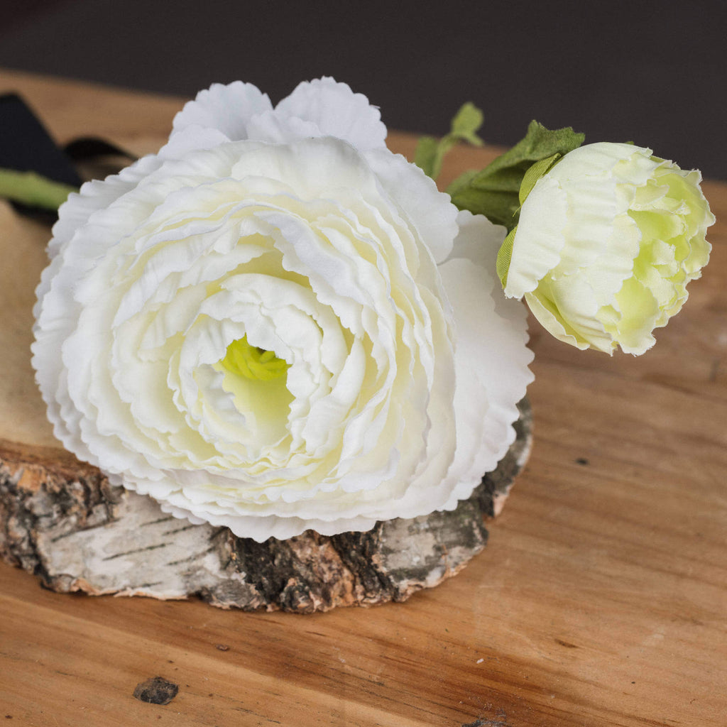 White artificial ranunculus spray with lifelike petals, 68cm long, perfect for home decor or floral arrangements. by Sostter at brixbailey.com
