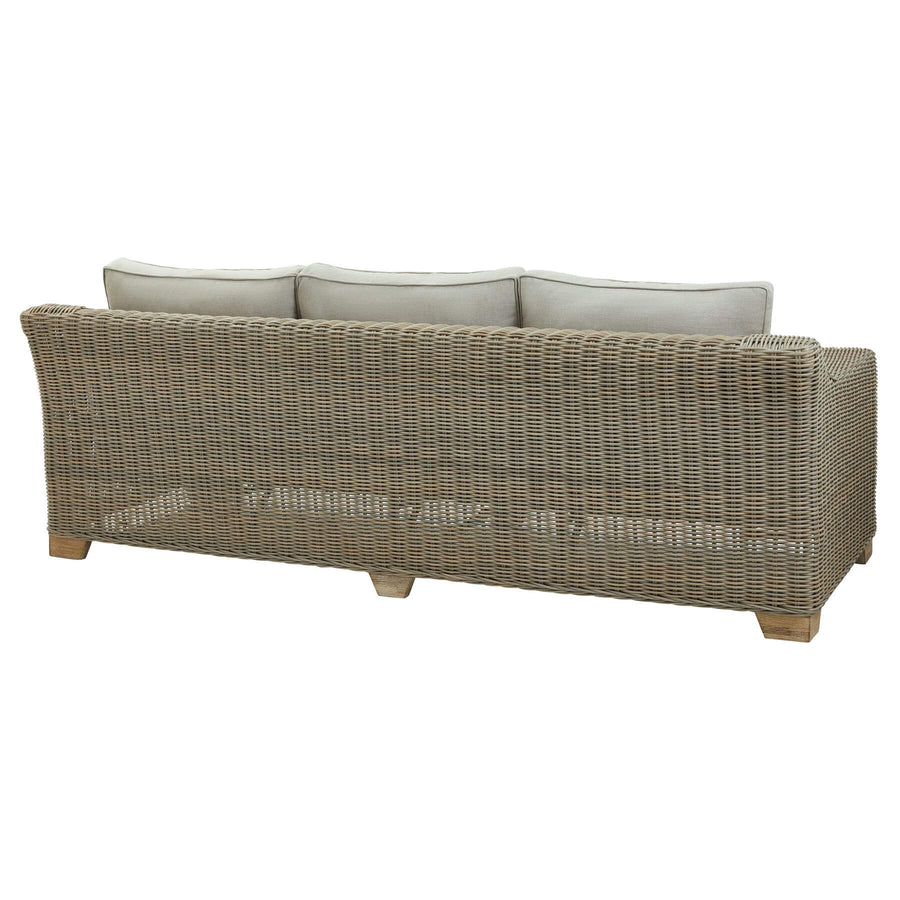 Handcrafted beige wicker sofa with HDPE weave, aluminum frame, and acacia wood feet for outdoor luxury seating. by Sostter at brixbailey.com
