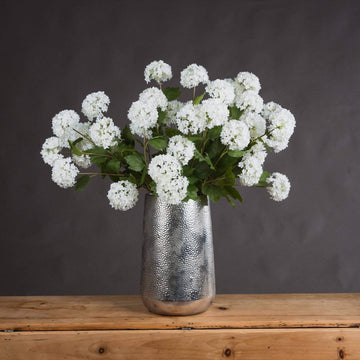 Lifelike white faux snowball blossom stem, 75cm tall, with realistic petals and flexible branches for home decor by Sostter at brixbailey.com