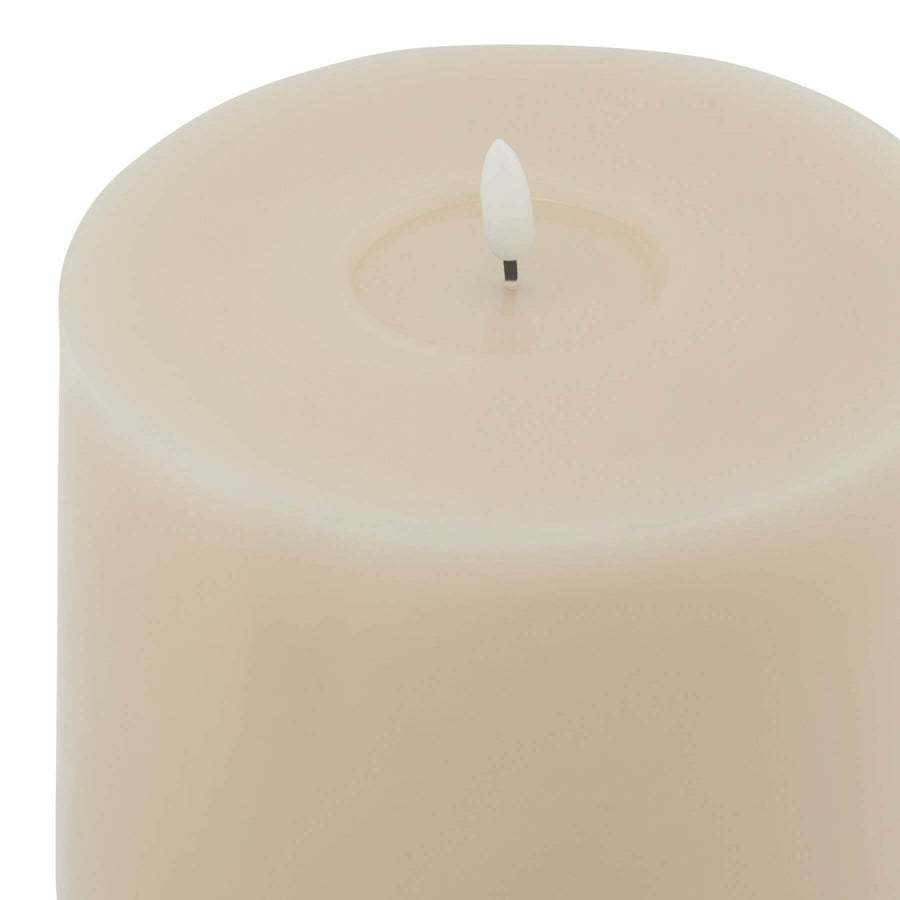 Realistic taupe LED wax candle with dripping effect, safe flameless flicker for cozy ambiance. by Sostter at brixbailey.com