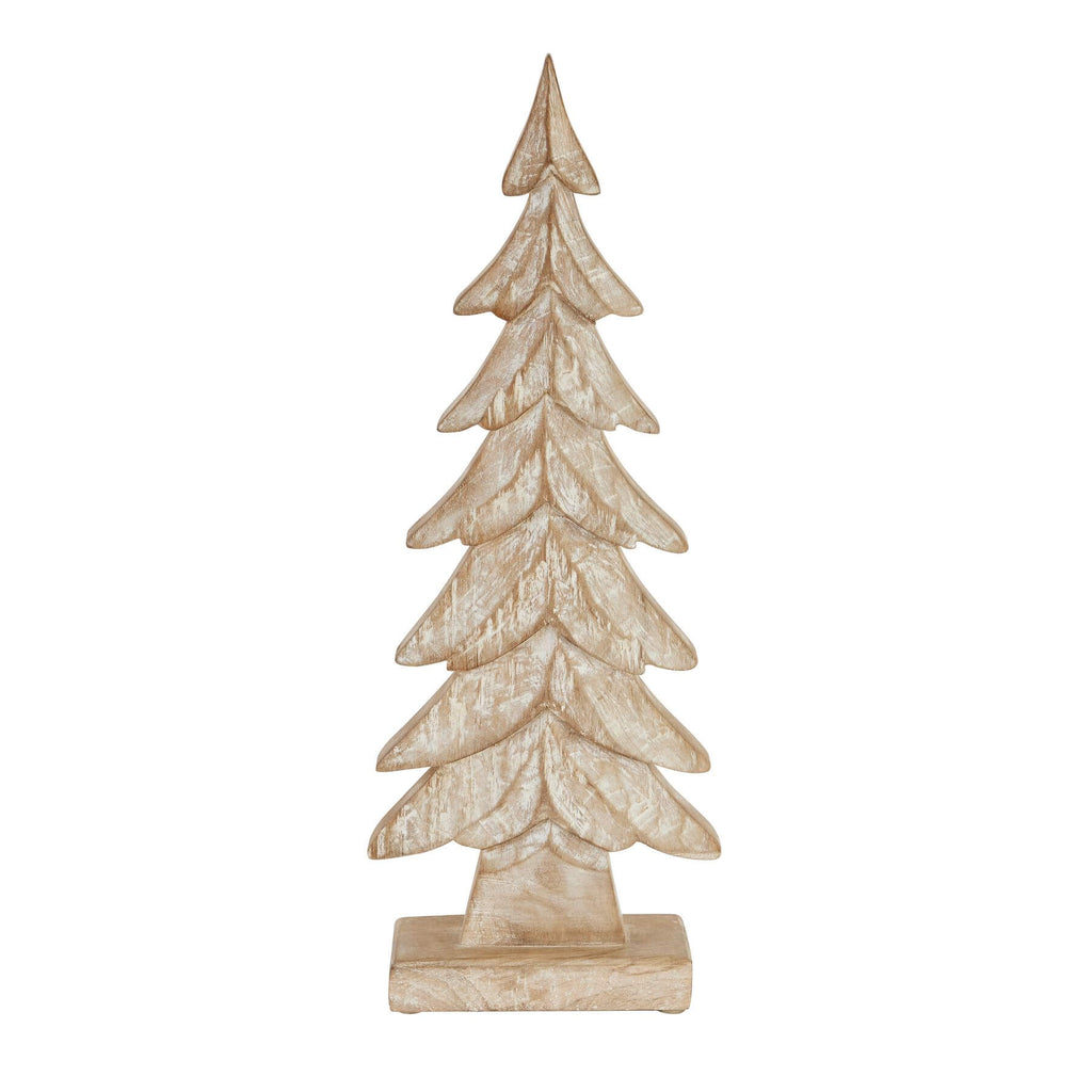 bold hand-carved wooden christmas tree centerpiece casting dramatic holiday shadows