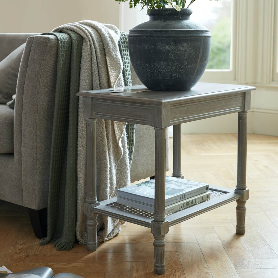Handwoven rattan side table with tapered legs in soft grey, 60cm height, modern organic texture for coastal or minimalist decor by Sostter at brixbailey.com