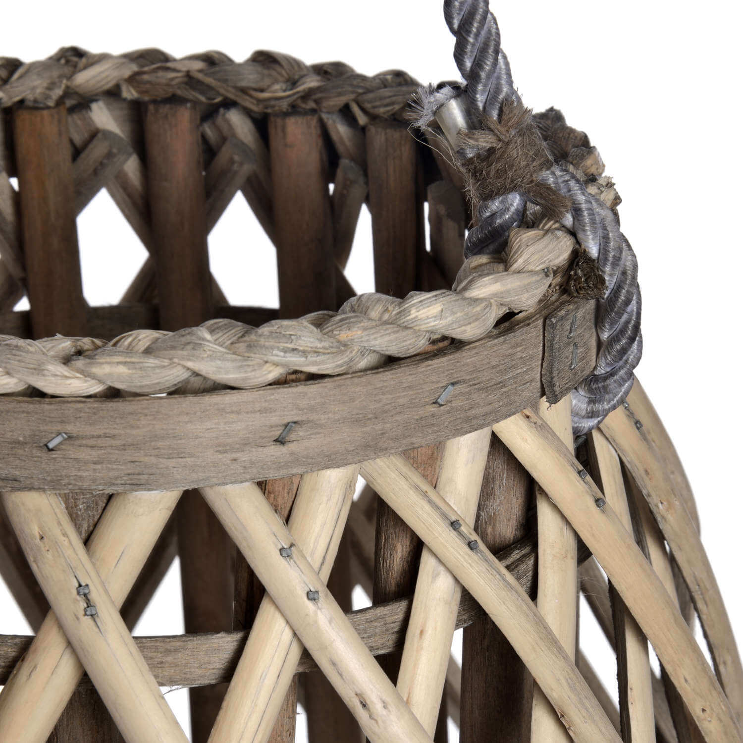Handwoven rattan lantern with warm brown tones, creating enchanting light patterns for indoor or outdoor decor. by Sostter at brixbailey.com