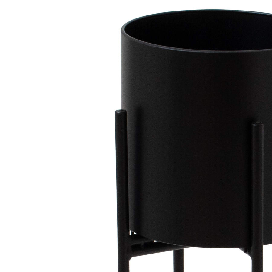 Modern matte black metal cylindrical planter, 72cm tall, with minimalist geometric design for indoor plants by Sostter at brixbailey.com