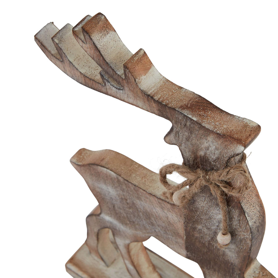 Handcrafted white-washed wooden reindeer decor with Scandinavian design, geometric silhouette, and rustic distressing. by Sostter at brixbailey.com