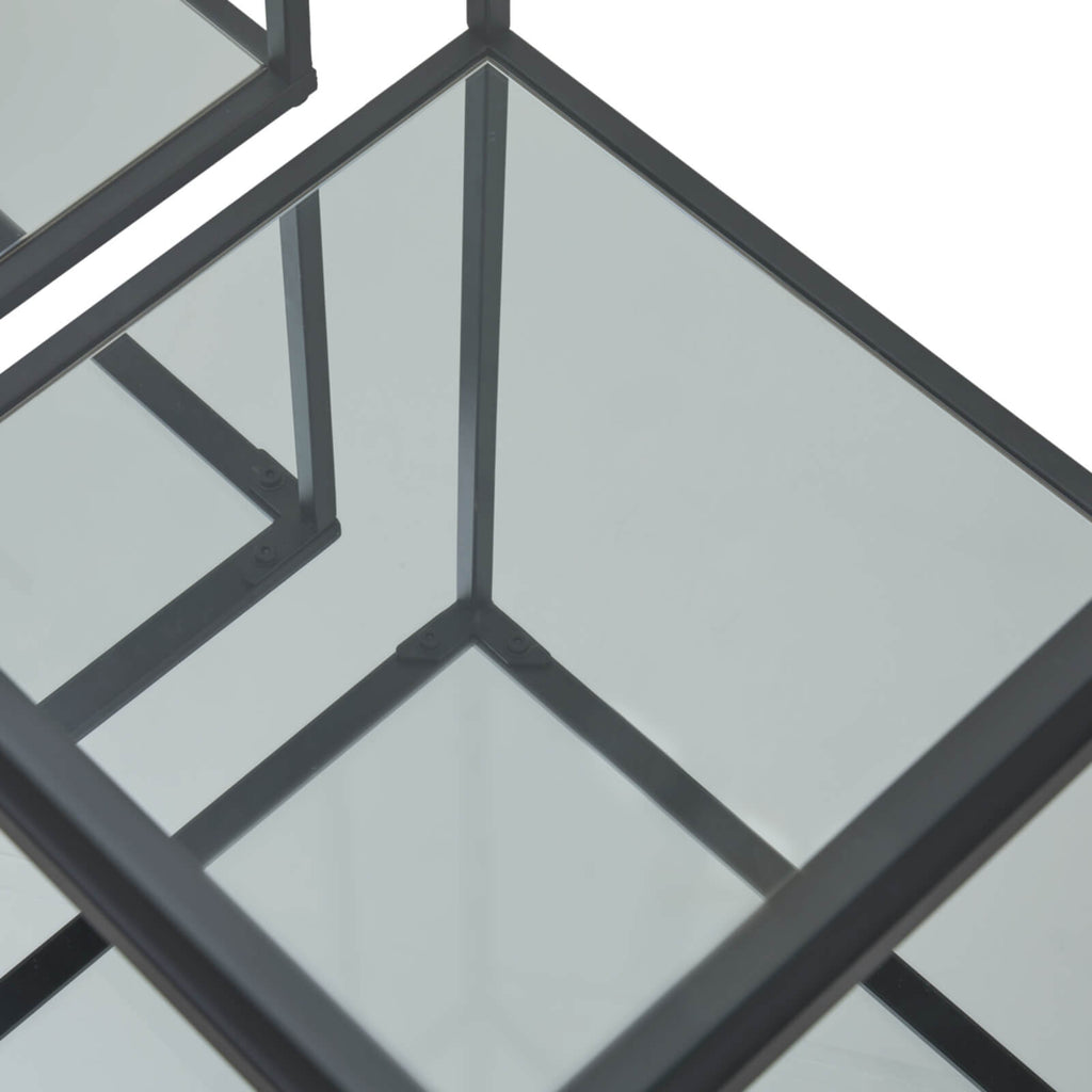 Pair of modern black metal and glass side tables with minimalist design for contemporary living rooms by Sostter at brixbailey.com
