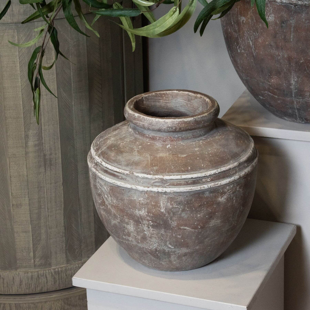 Distressed brown ceramic Siena water pot with urn shape, organic textures, and handcrafted glaze for floral displays. by Sostter at brixbailey.com