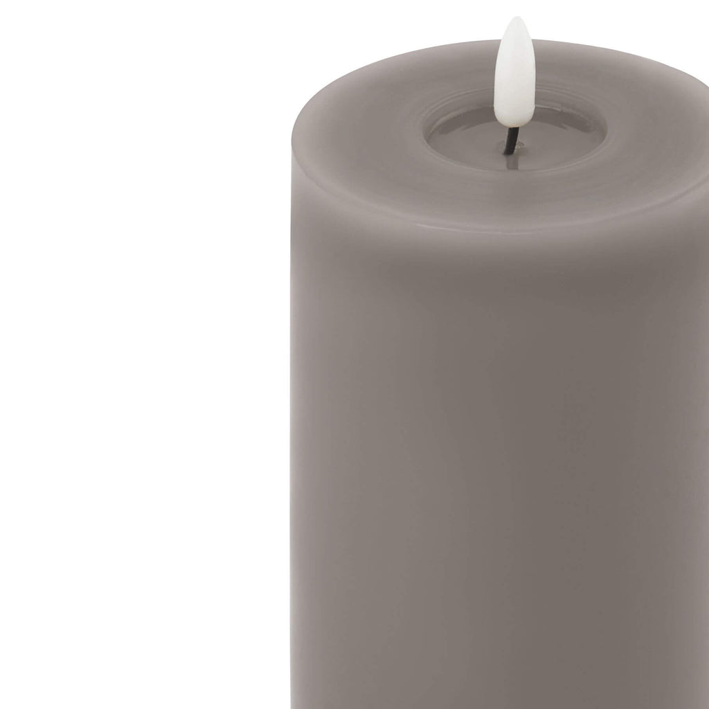 Grey LED wax candle with realistic melt effect and flickering flame, 23cm tall, battery-operated for safe ambiance by Sostter at brixbailey.com