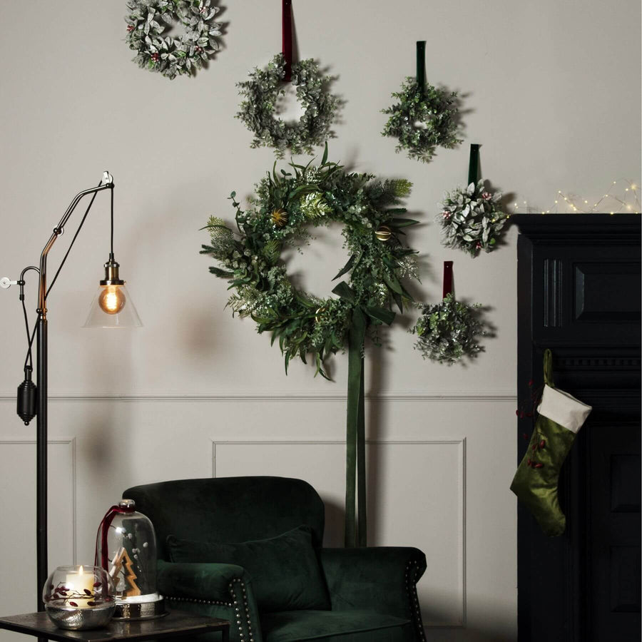 Frosted eucalyptus wreath with candle center, handcrafted winter decor in 25cm diameter, realistic plastic foliage by Hill Interiors at brixbailey.com