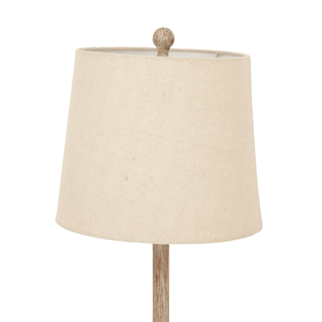 Brown candlestick table lamp with linen shade, warm ambient lighting for modern or traditional interiors. by Sostter at brixbailey.com