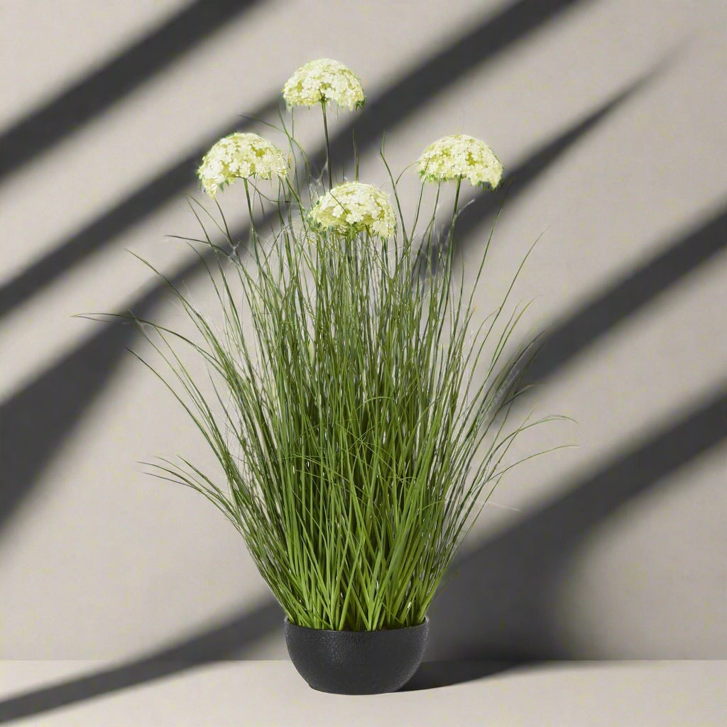 Lifelike faux white Allium plant in black pot, 120cm tall with spherical blooms, perfect for modern home decor by Sostter at brixbailey.com