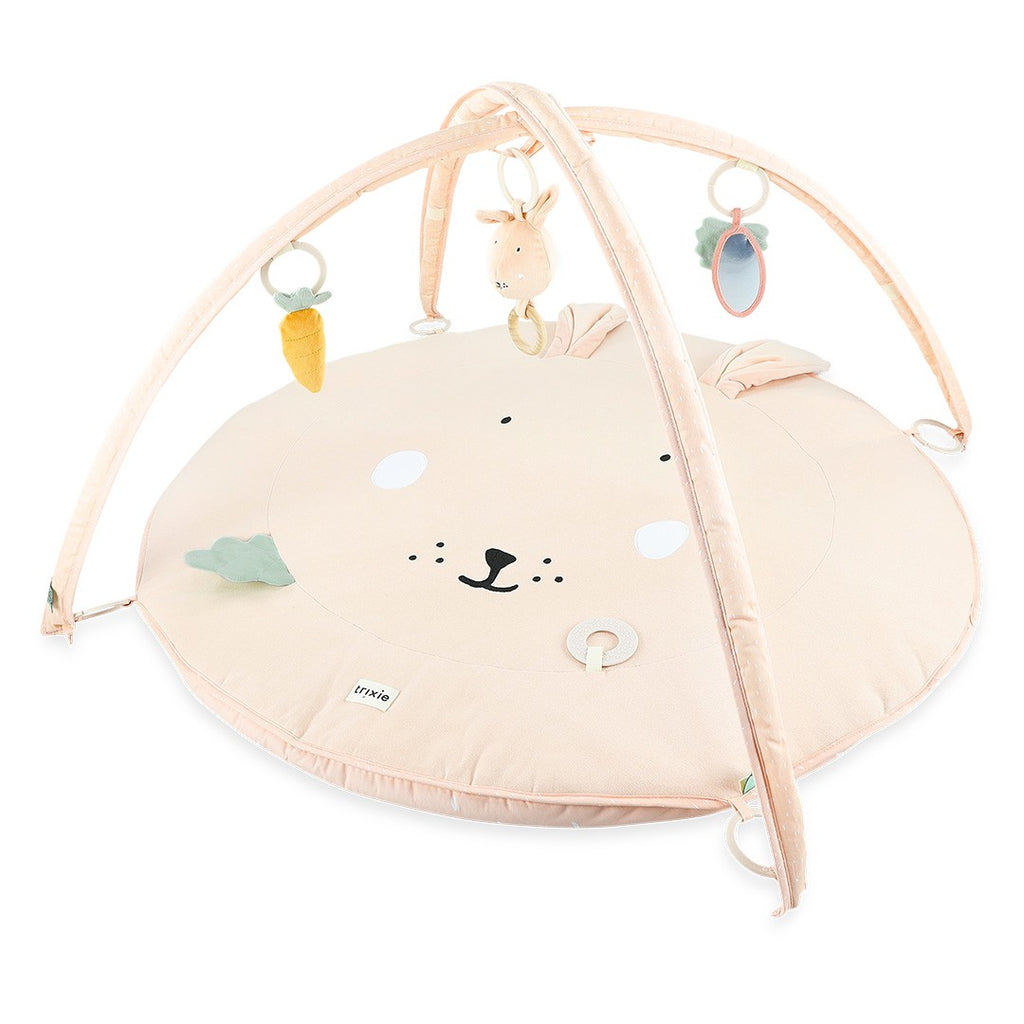 This exciting play mat, with its two arches and lots of fun activity toys, guarantees hours of play. It includes a teether, mirror, wooden rings, rattle, crinkle paper, fun fringes and flappy ears with different textures, ready to tickle all your child's senses. by Trixie Baby at www.brixbailey.com