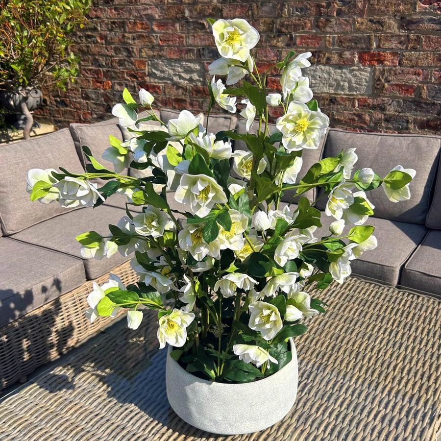 White faux hellebore floral arrangement in grey planter, lifelike blooms with green stems, home decor centerpiece by Sostter at brixbailey.com