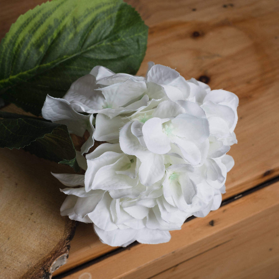 Lifelike white Schneeball hydrangea stem in vase, hyper-realistic artificial flower for elegant home decor by Sostter at brixbailey.com
