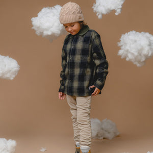 bold wheat-colored alpaca cable hat for kids, front view showcasing its chunky knit and sustainable luxury
