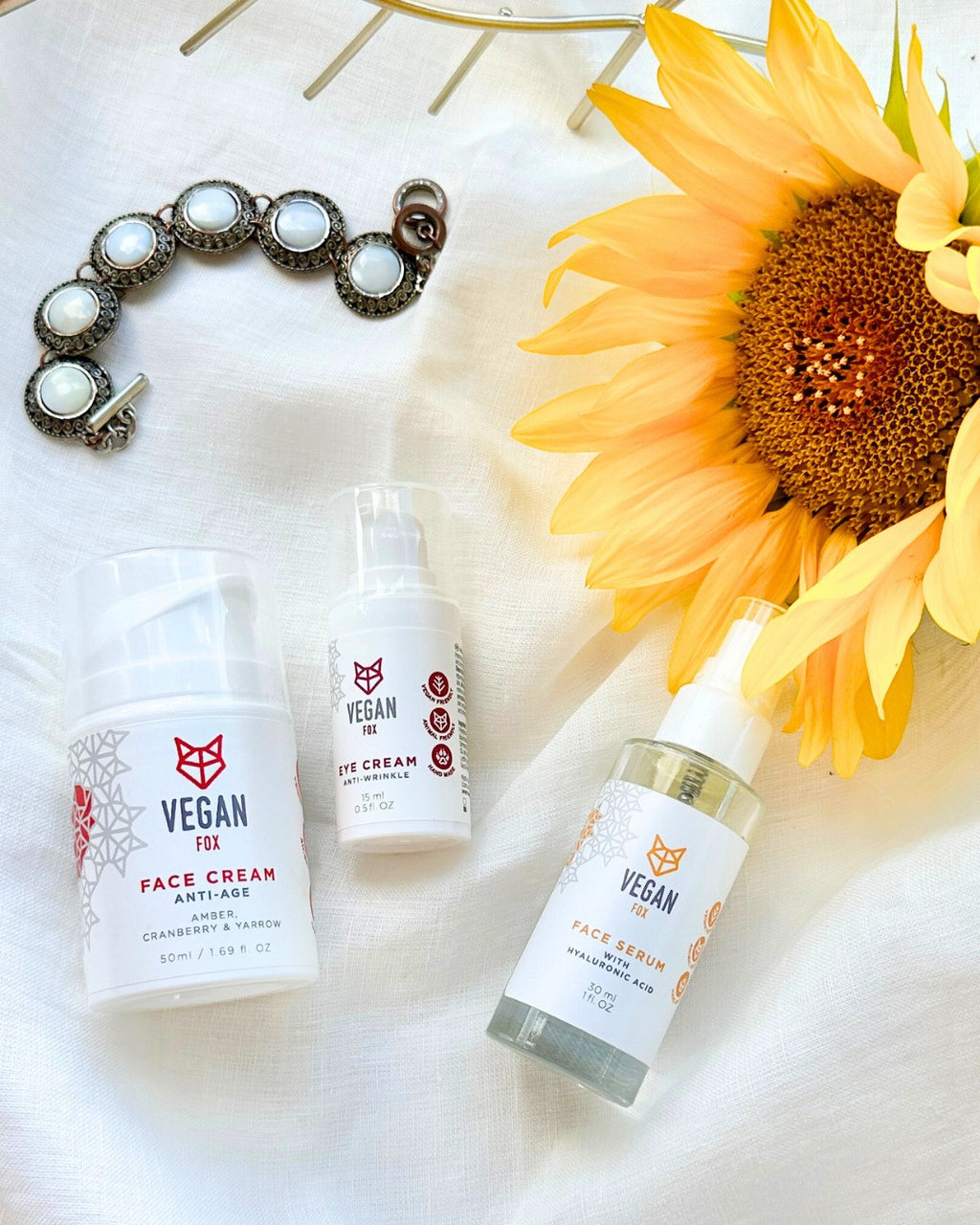 soft-lit anti-age face care set with creamy textures, showcasing the eye cream and serum in a cozy morning skincare ritual